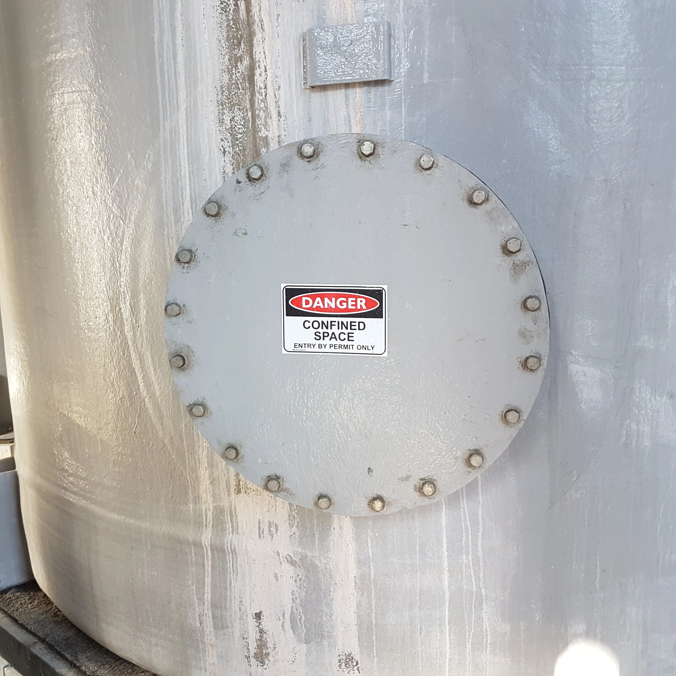 Industrial storage tank with confined space warning